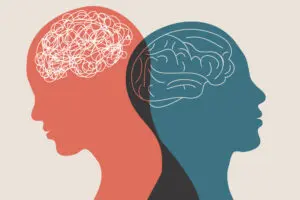 Illustration of two overlapping silhouettes in profile. One is red with a tangled line representing a chaotic brain, and the other is blue with a clear line sketch of a brain, symbolizing clarity or calmness.